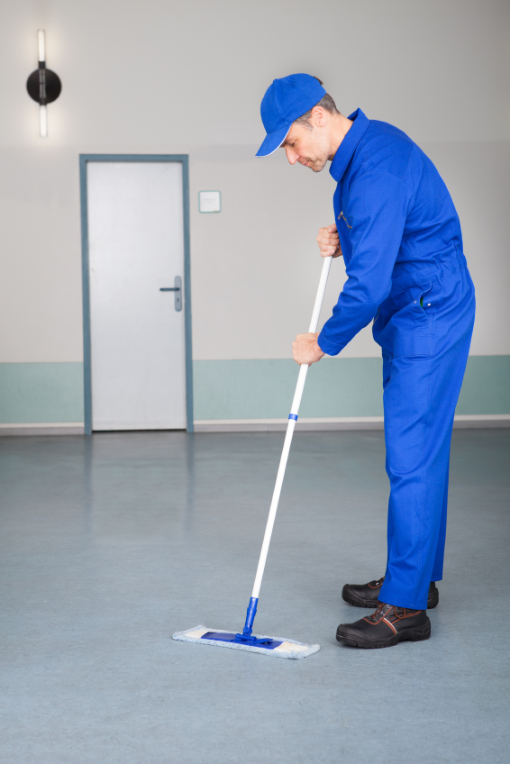 Worker Cleaning Epoxy Floor